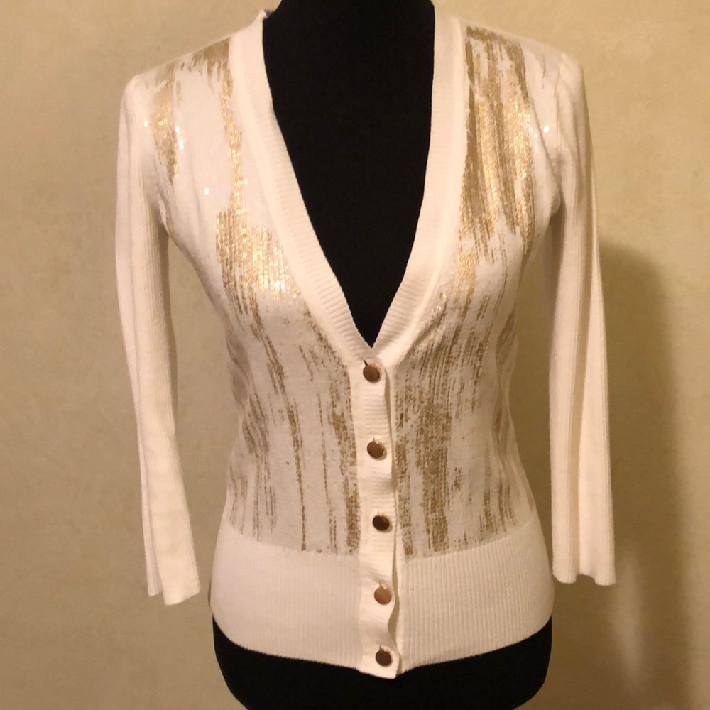 White and gold sweater